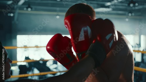 An aspiring female boxer engages in an intensive training regime with her personal coach, focusing on mastering the art of boxing in an energetic gym atmosphere. Camera 8K RAW.