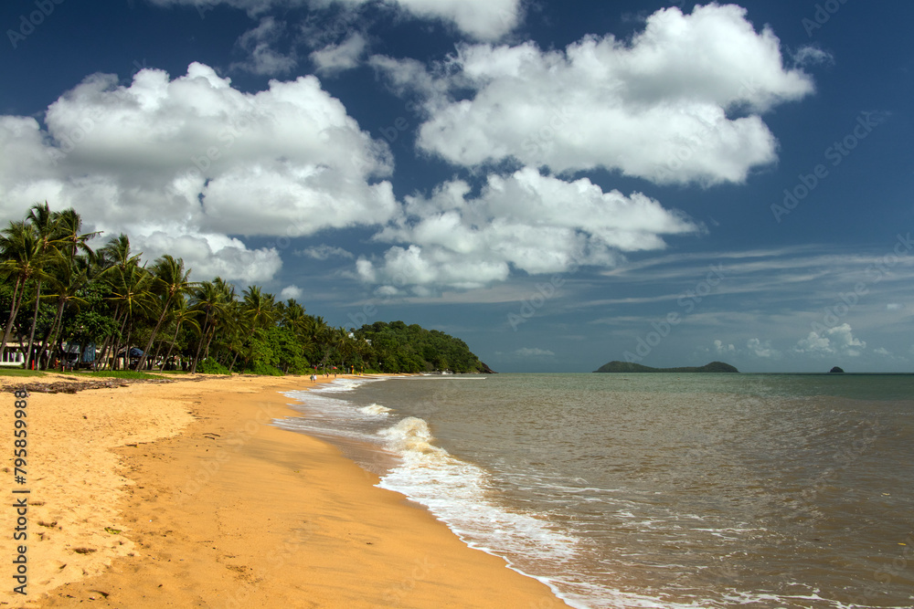 Trinity Beach, Queensland, Australia, offers a serene coastal lifestyle, where azure waters meet golden sands amidst lush tropical greenery.