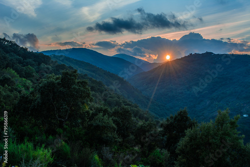 African mountain valley during sunset. Natural summer landscape, Hilly background, Orange sunset in mountain, Silhouettes of mountain hills at sunset. mountain cascade in jijel Algeria, North Africa.