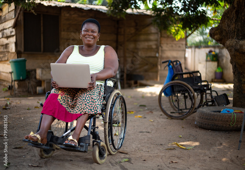 Disabled black woman watching a video on her laptop photo