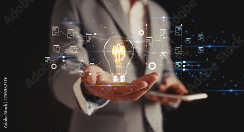 Solution or creative idea for designing a web banner or landing page for an innovative company with a hand sticking out of the screen with a light bulb. Famous abstract geometric shapes and lead lines