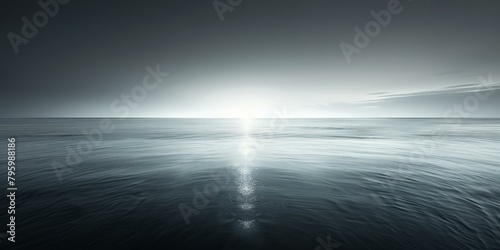 b'dark sea surface with bright sun reflecting off the water'