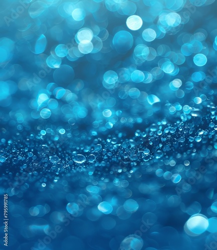 b'Blue water droplets on a blue background with a blurred background'