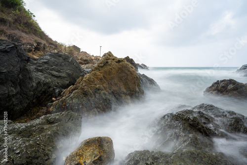 Long exposure cloudy coastline scenery.