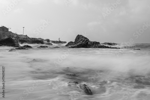 Long exposure black and white photos of coastline scenery.