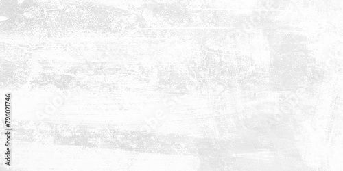 Wall fragment with scratches and cracks. White grunge cement wall background. Seamless texture of white cement wall a rough surface  with space for text  for a background.