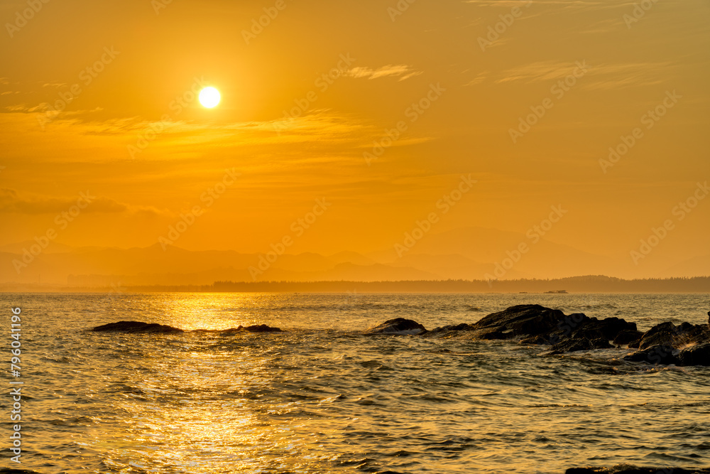 Obraz premium Coastal rocks at sunset.