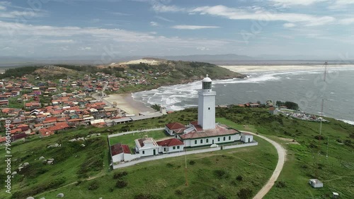 Aerial view of Santa Marta Lighthouse and Santa Marta Beach - Laguna, Santa Catarina, Brazil photo