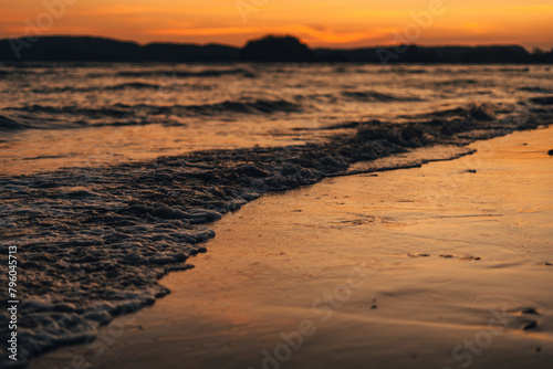 Beach and sea waves in the evening before sunset