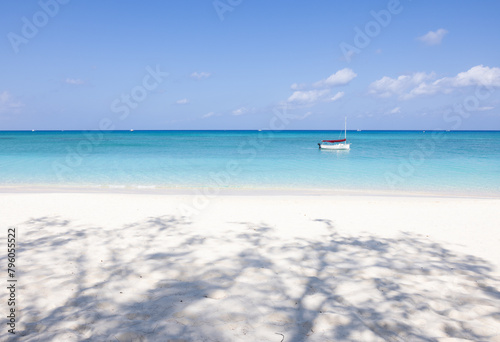boat near the white sand beach in Grand Cayman, Caribbean