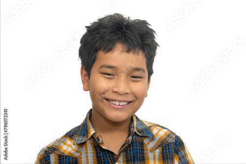 Portrait of a boy with messy hair looking at camera against white background