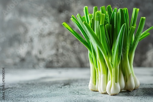 Fresh green spring sweet Garleek on textured background. photo