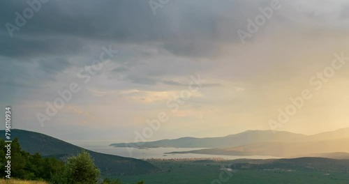 Delphi, Greece. Clouds with rain over the valley. After sunset the clouds clear and night falls. Northern coast of the Gulf of Corinth, Itea Bay, TimeLapse photo