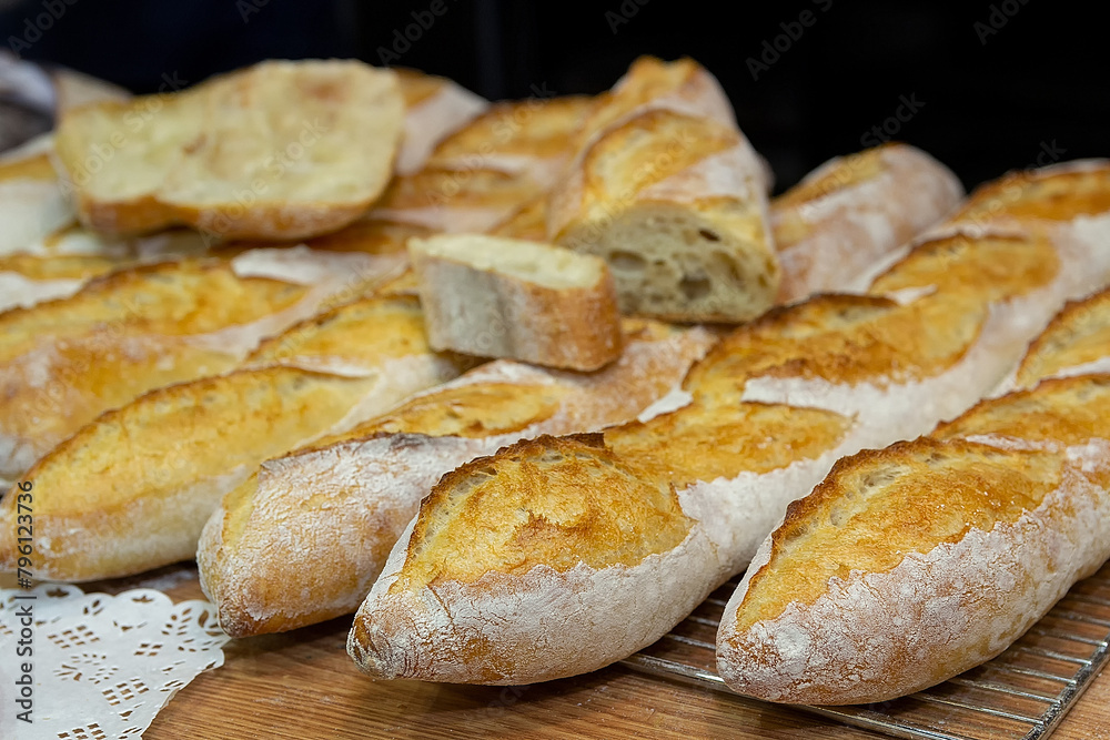 Delicious handmade baguettes in bakery window. Food