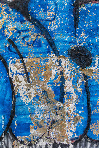 Blue and red graffiti on wall. Abstract detailed wall texture with blue graffiti paint. (ID: 796133317)