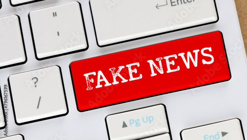 FAKE NEWS words on the red key of the computer keyboard.