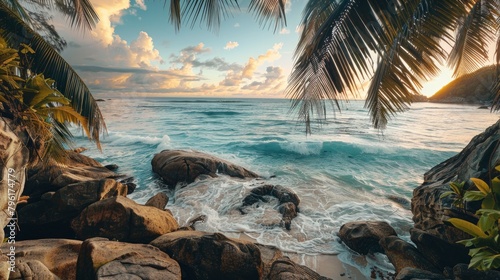 A view of the sea from rocks and palm trees on Seychelles, a beautiful tropical island with clear blue water.