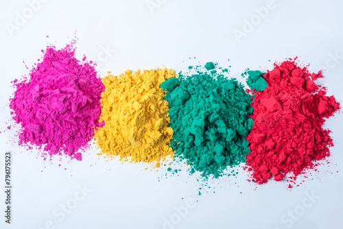 Pile of multicolored holi powder isolated on white background.