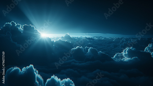 The sky is filled with clouds and the sun is shining through them. The image has a peaceful and serene mood photo