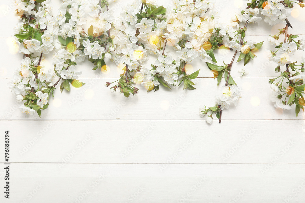 Beautiful blossoming branches on white wooden background Beautiful blossoming branches on white wooden background