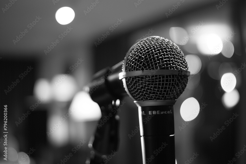 The microphone at a small business forum ready to amplify the stories of entrepreneurs overcoming economic challenges The microphone at a small business forum ready to amplify the stories of entrepreneurs overcoming economic challenges