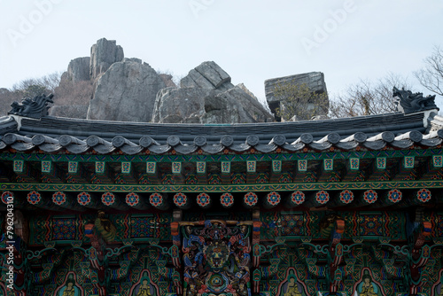 View of the rocks beyond the Buddhist temple building photo