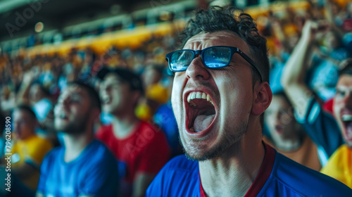 Group of men in stadium with their mouths open and sunglasses on.