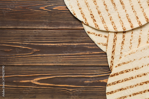 Tasty lavash on wooden background