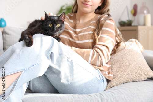 Woman sitting with cute bla...