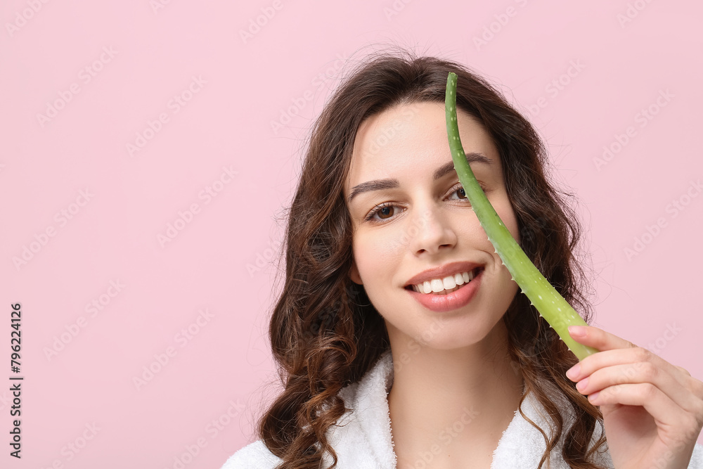 Beautiful young woman with aloe vera on pink background Beautiful young woman with aloe vera on pink background