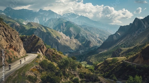 A panoramic view of a scenic mountain pass, with cyclists tackling the challenging terrain on World Bicycle Day. photo