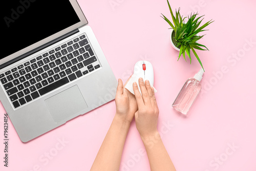 Woman with laptop and bottl...