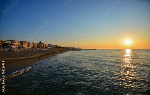 the sun rises in the absolute silence of the Jesolo Lido beach