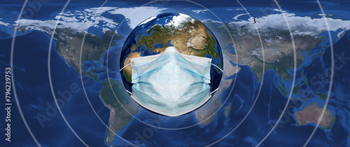  image of the globe on which a medical mask is worn against the background of a geographical map of the world