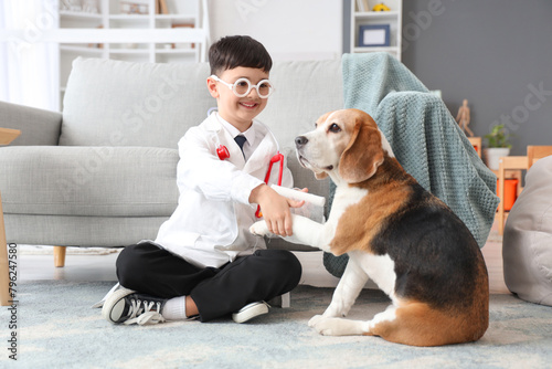 Cute little doctor bandagin...