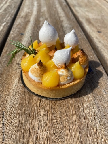 gourmet lemon meringue pie on a wooden background 