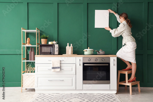 Woman decorating modern kit...