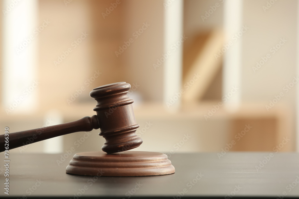 Judge's gavel on black table in office, closeup Judge's gavel on black table in office, closeup