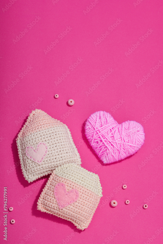 Handmade Valentines Day concept. Creative house figurines, traditional hearts, spring crocheting Handmade Valentines Day concept. Creative house figurines, traditional hearts, spring crocheting