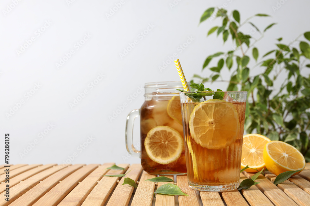Fototapeta premium Cold tea with fresh oranges and mint leaves