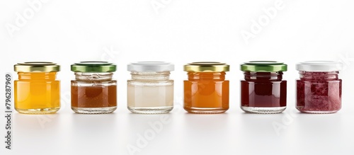 A variety of colorful fruit preserves in glass jars