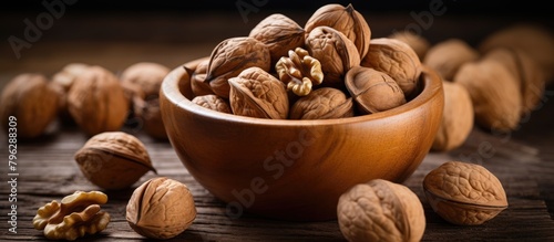 Bowl of walnuts on table photo