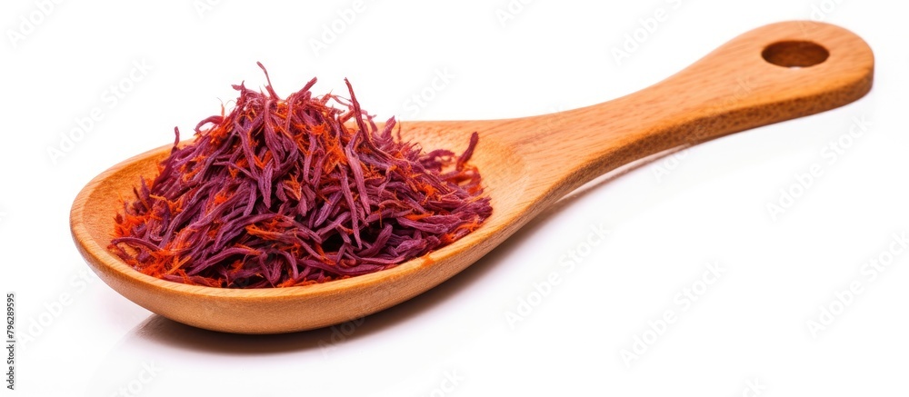 Fototapeta premium Close-up wooden spoon brimming with saffron