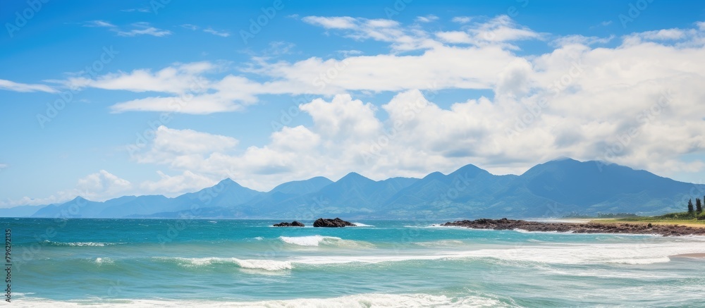 Beach with towering mountain backdrop
