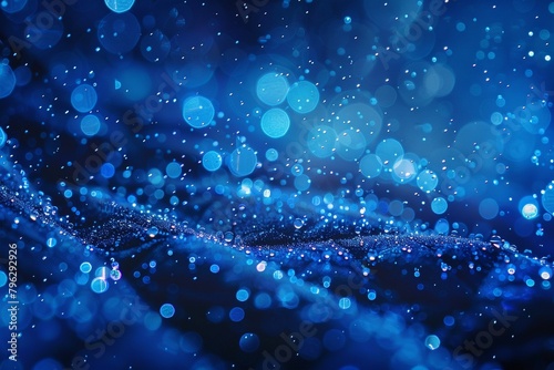 Droplets of liquid fall from the sky, their electric blue hue forming a mesmerizing pattern similar to snowflakes This natural artistry becomes a fashionable accessory, adding a touch of sophisticatio photo