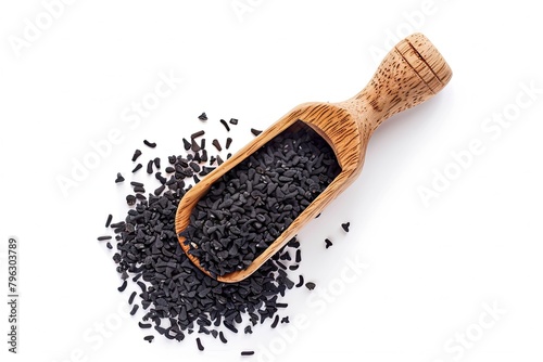 Black cumin seed (Nigella sativa) in wooden scoop isolated on white background Top view