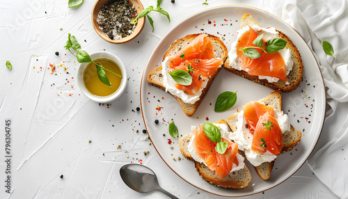 Plate of tasty toasts with cream cheese on white tile background