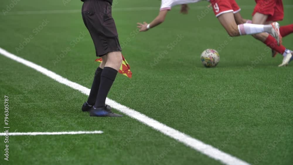 Side Judge, Concept of Refereeing in Football. Professional Soccer Players Attacks, Fall Down, Foul. Athlete In Pain Lying on the Grass 