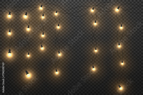  Glowing golden Christmas lights and New Year's garlands. Lights on a transparent background. © DENYS