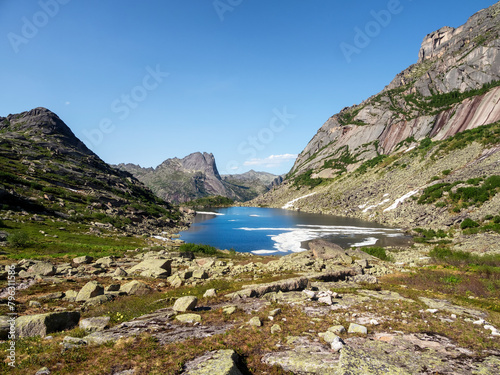 Mountain lake in the block stream valley. Summer landscape